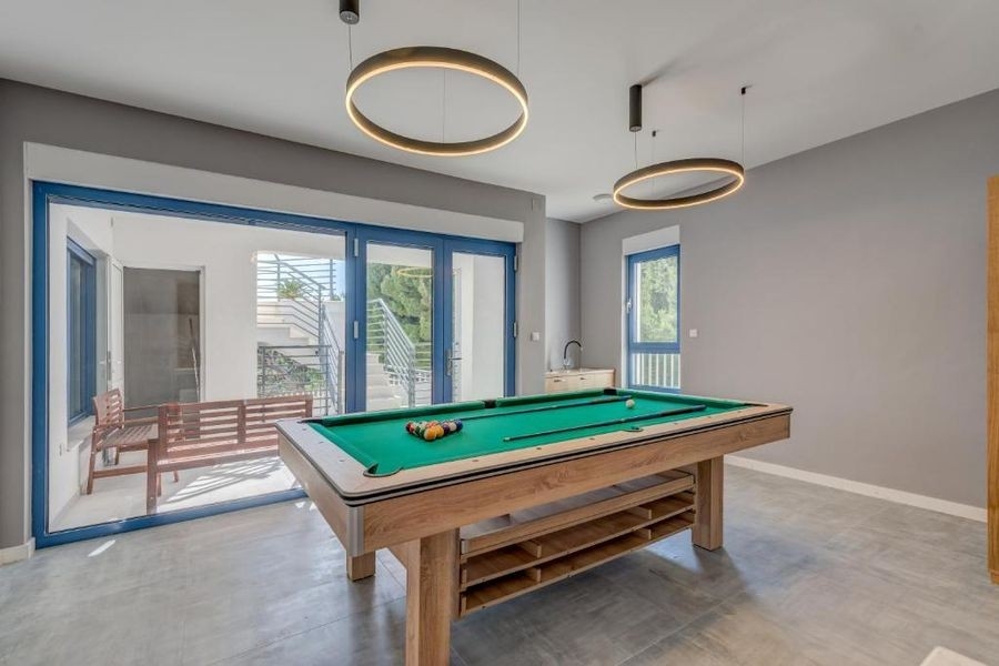 Billiard room with terrace access