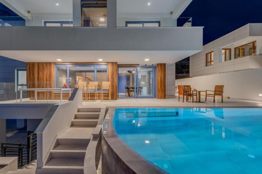 Villa with pool at dusk