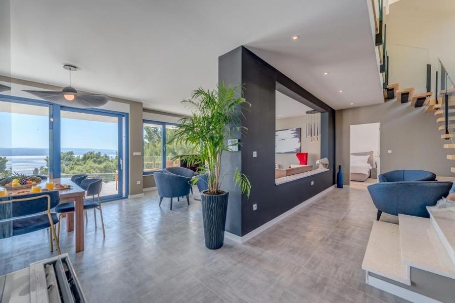 Open plan living and dining area with sea views