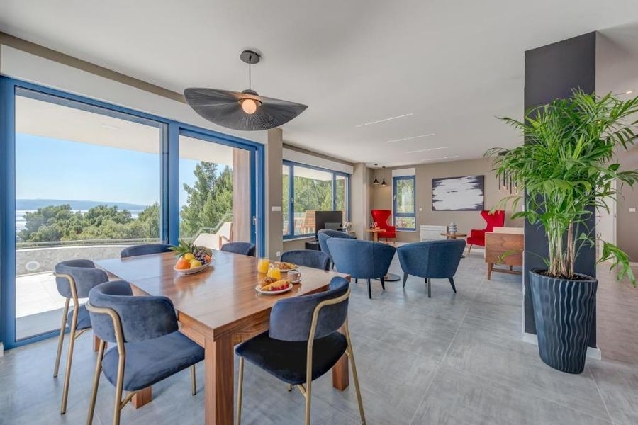Dining area with large window front and sea view