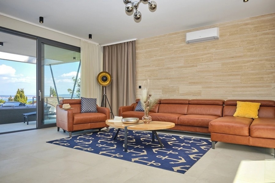 Sun terrace with heated pool and sea views