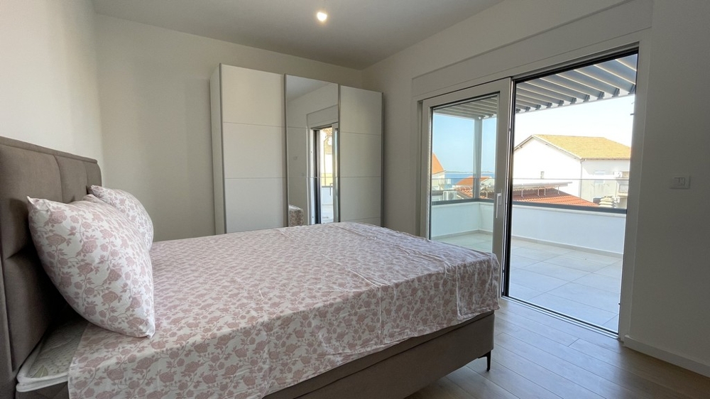 Bright bedroom with large window front