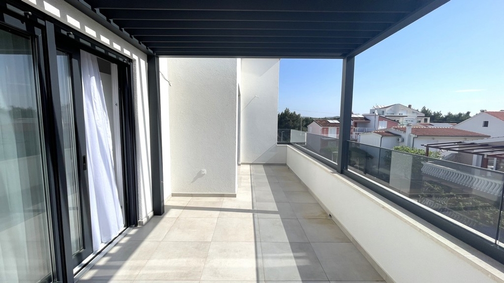 Covered terrace with glass railings