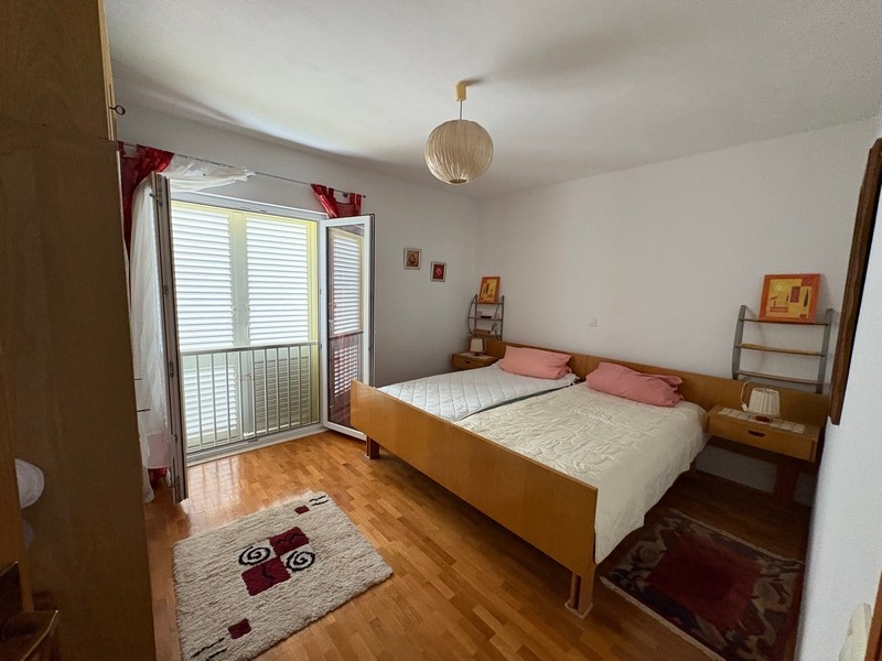 Bedroom with double bed and patio door