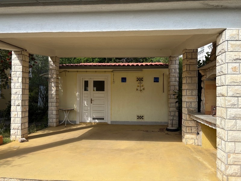 Covered terrace with entrance to the house