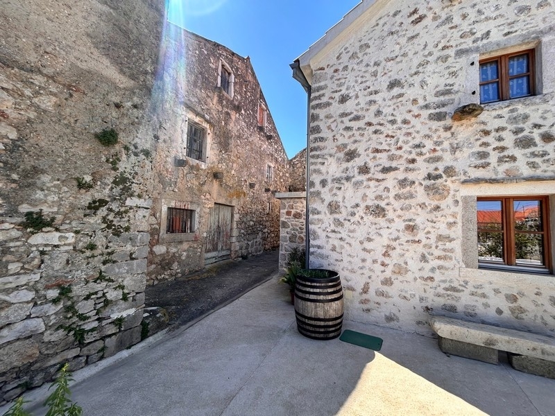 Paved courtyard between stone houses