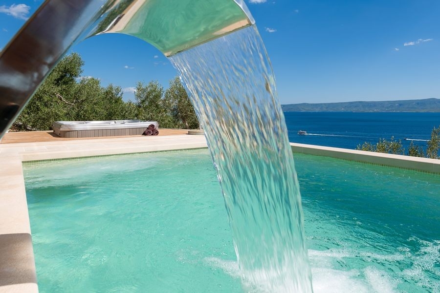 Waterfall shower at the swimming pool with sea views