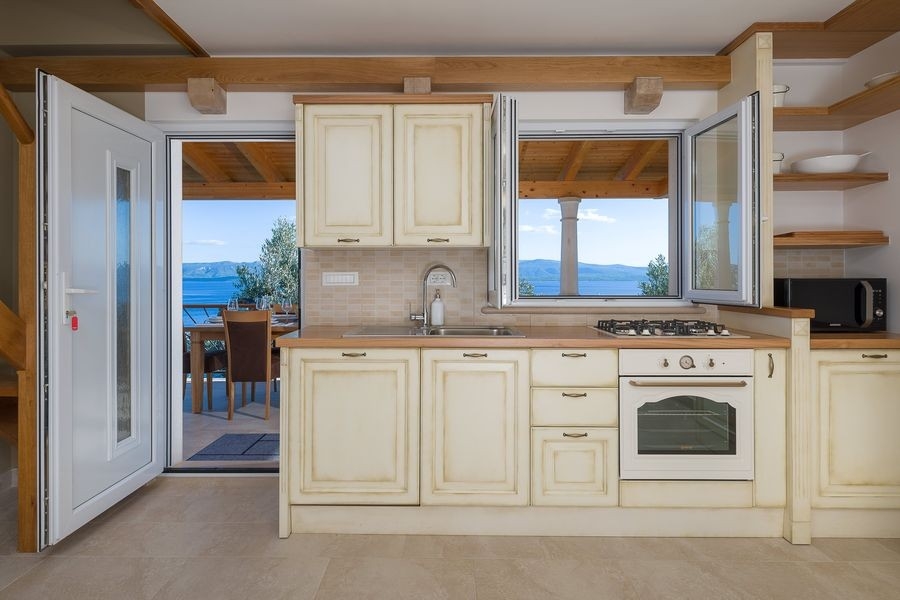 Bright kitchen with window to the sea