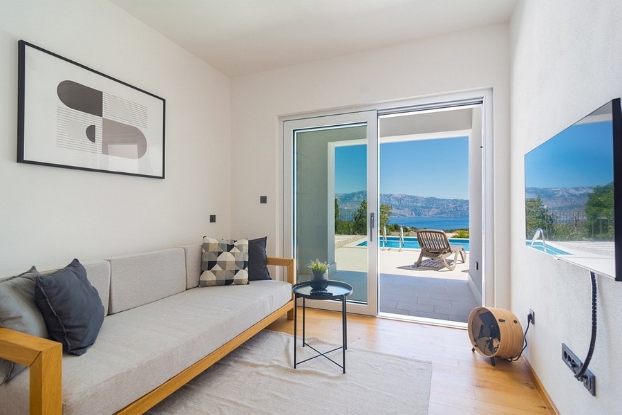 Living area with terrace access and sea views