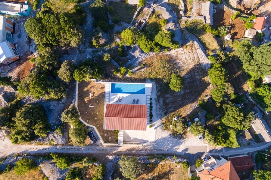 Aerial view of house and pool on Brac