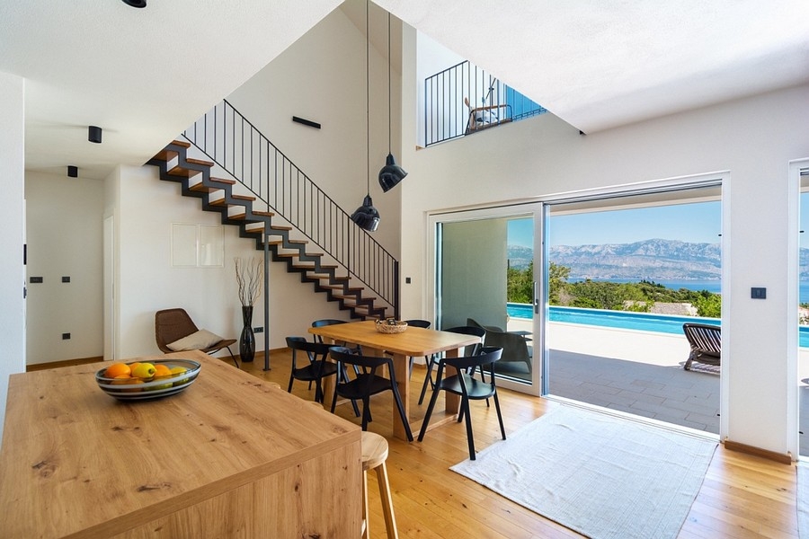 Dining area with stairs and terrace access