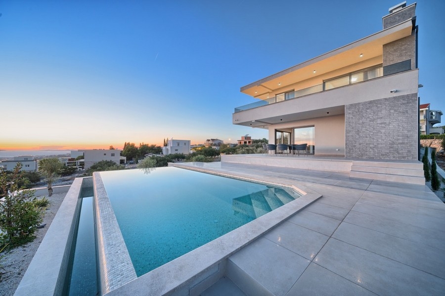 Villa with swimming pool at sunset