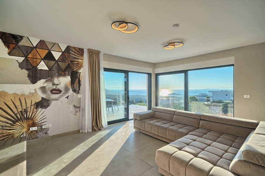 Bright living area with sofa and sea views