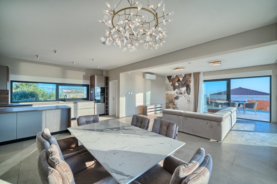 Living area with table and modern kitchen