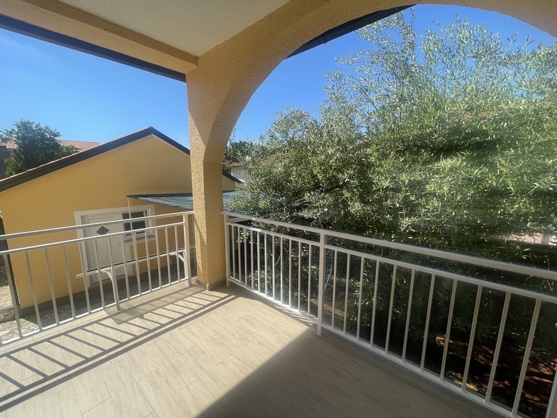 Covered terrace with garden views