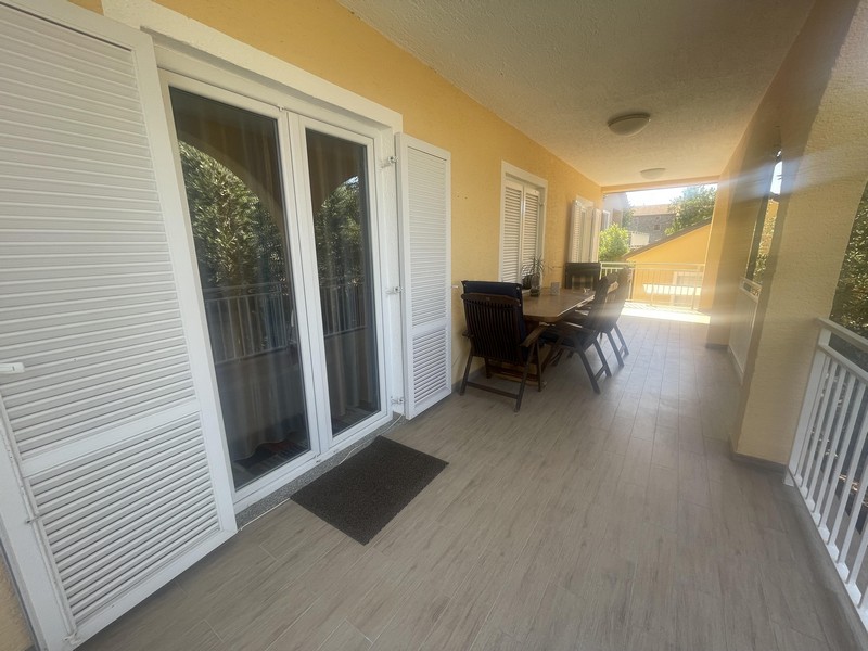 Long covered balcony on the house