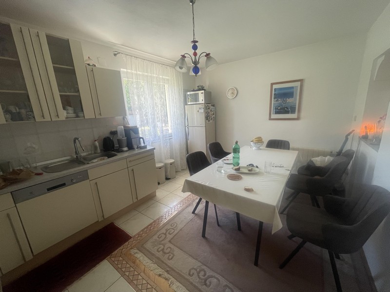 Bright kitchen-living room with seating area