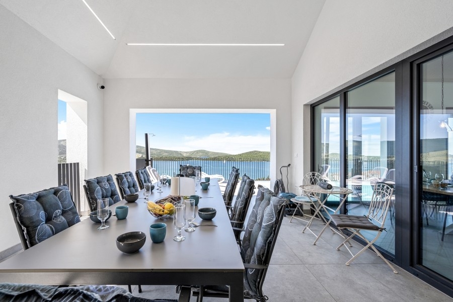Bright dining area with large windows and sea views
