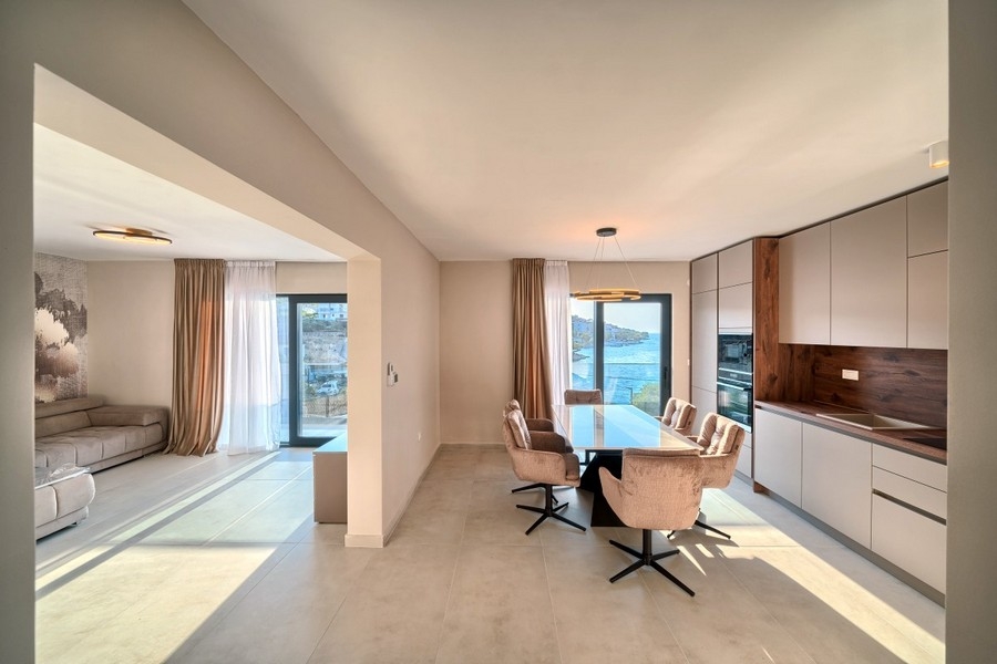 Open plan living and dining area with sea views