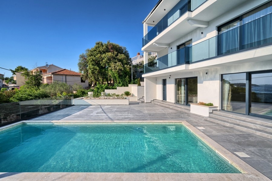 Modern villa with pool and large glass front