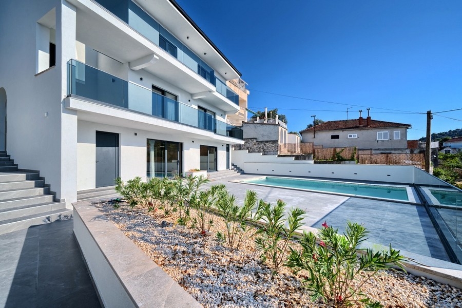 Villa with balconies, garden and swimming pool
