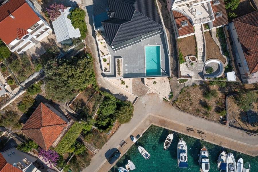 Aerial view of villa with pool near the sea