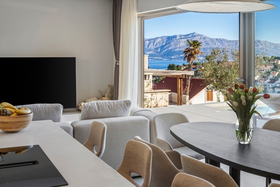 Bright living area with sofa and television