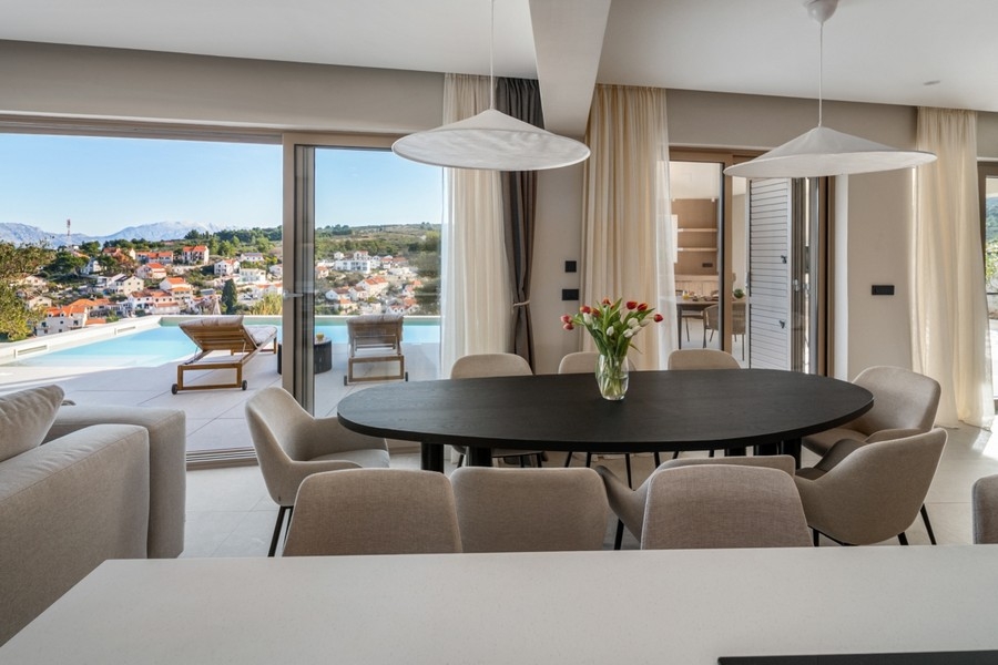 Living area with dining table and sea views