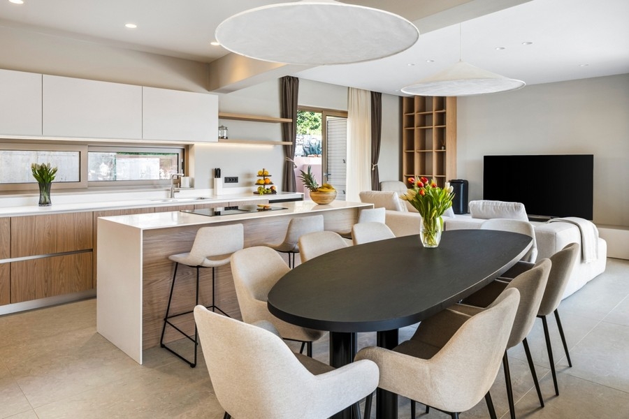 Open kitchen with dining table and living area