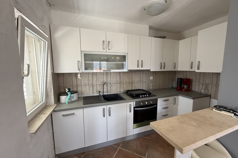 Kitchen with white fitted cupboards