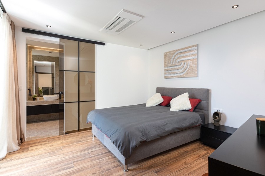 Bedroom with bed and sliding wardrobe