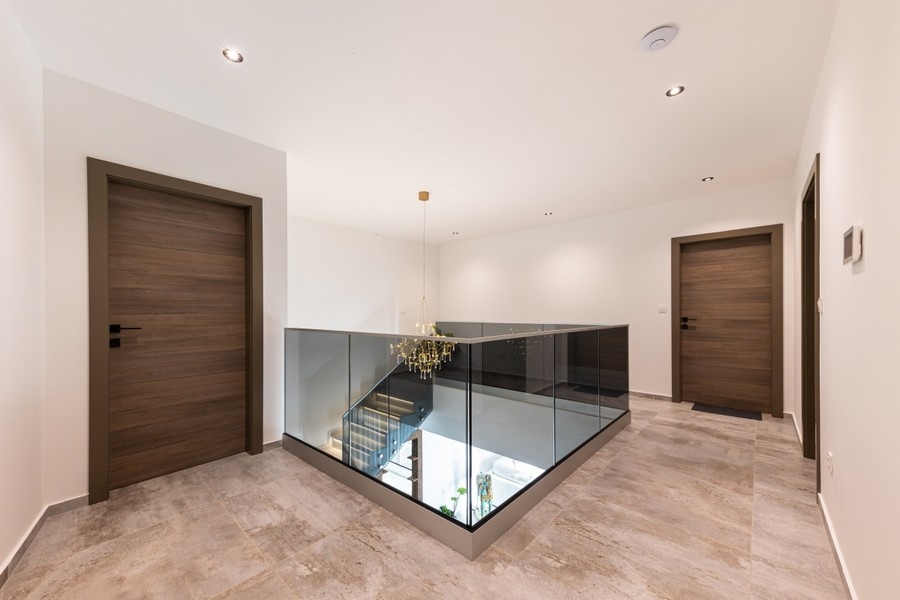 Gallery on the upper floor with glass railings