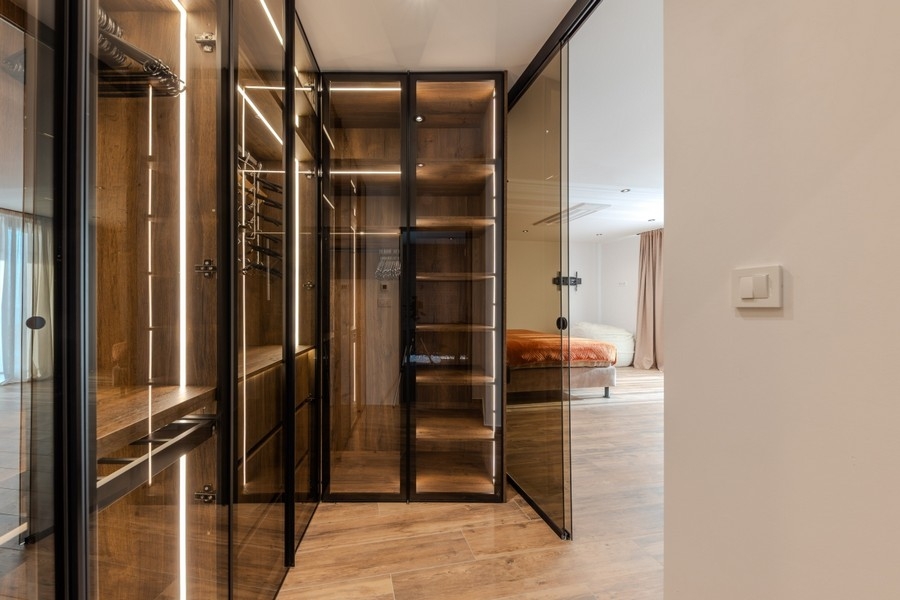Walk-in closet with glass fronts