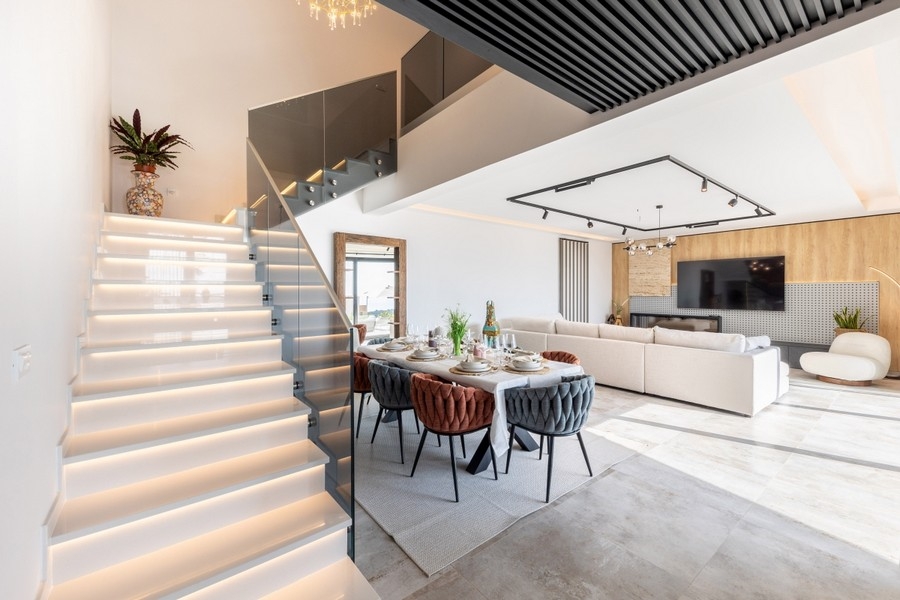 Open living area with stairs and seating area