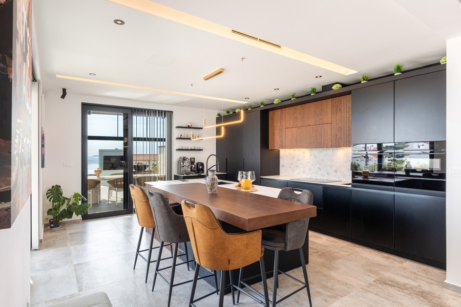 Modern kitchen with cooking island and seating