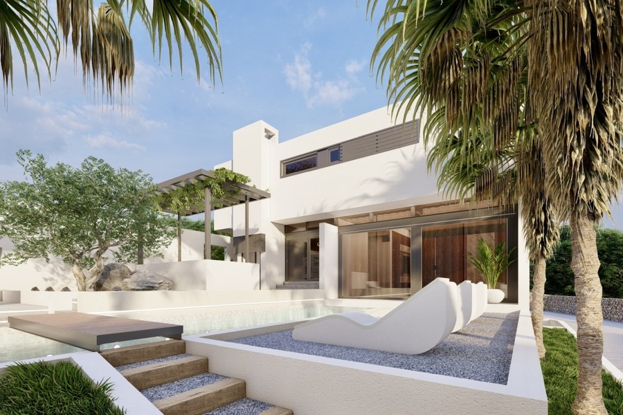 Pool area of ​​the villa with sun loungers and pergola