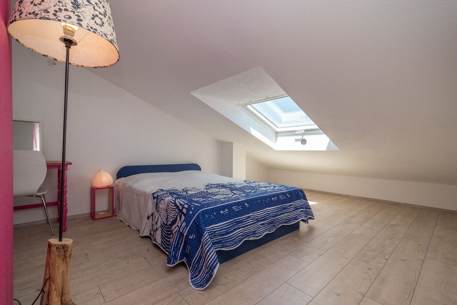 Attic bedroom with skylight