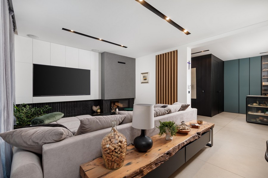 Bright living area with fireplace and television