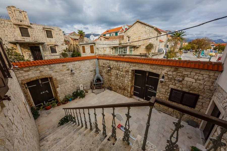 Courtyard with fireplace and stone walls