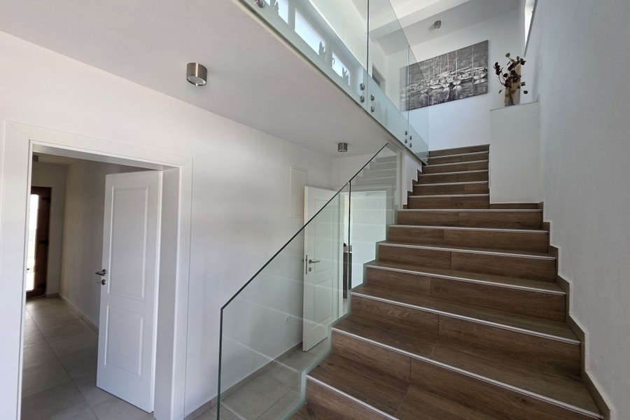Interior staircase with glass railings