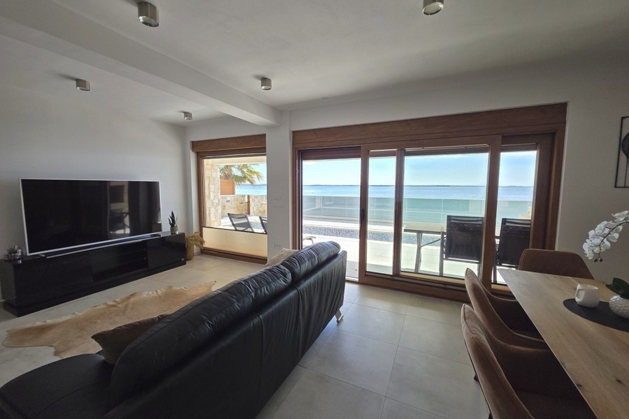 Living room with sliding door to the seaside terrace