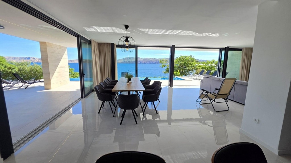 Living area with glass fronts and terrace access