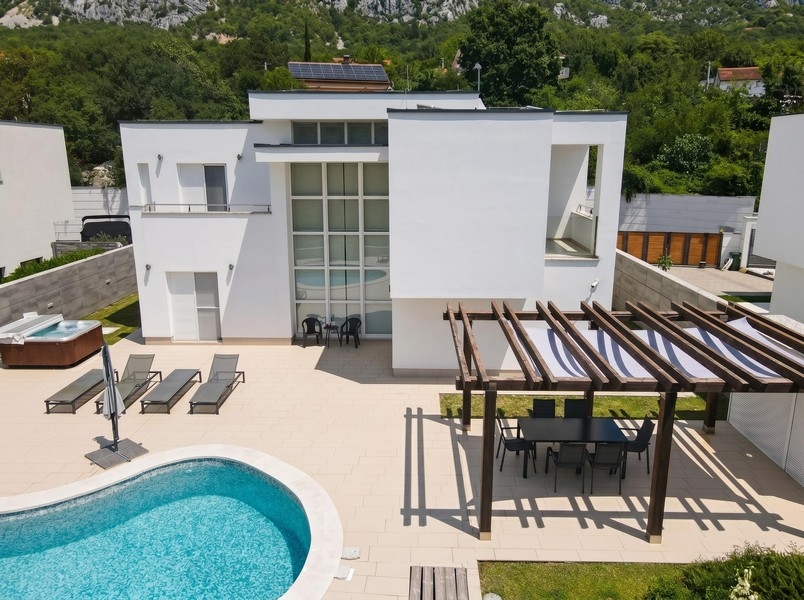 Sun terrace with loungers and pergola