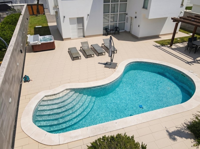Heated pool with stairs and lounge area