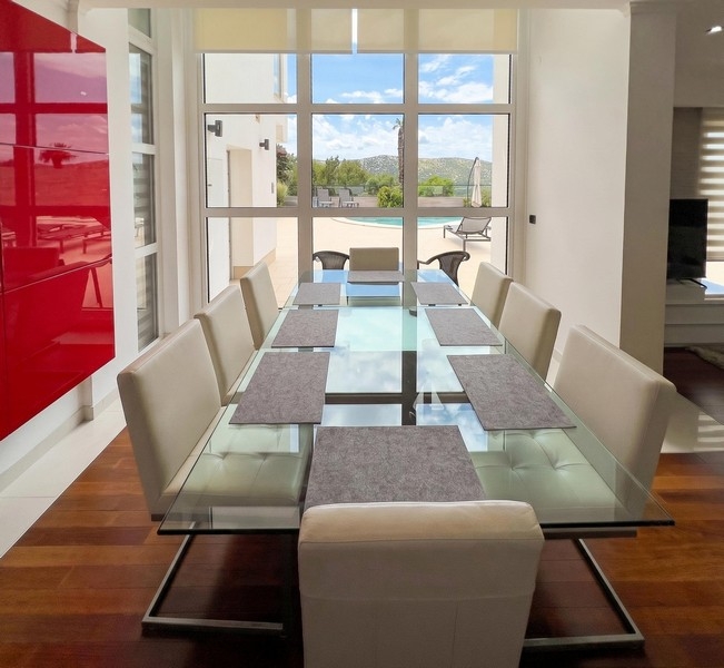 Bright dining area with large glass table