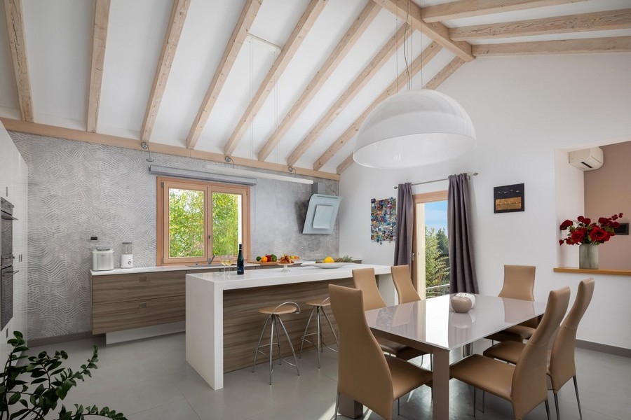 Kitchen with cooking island and seating area
