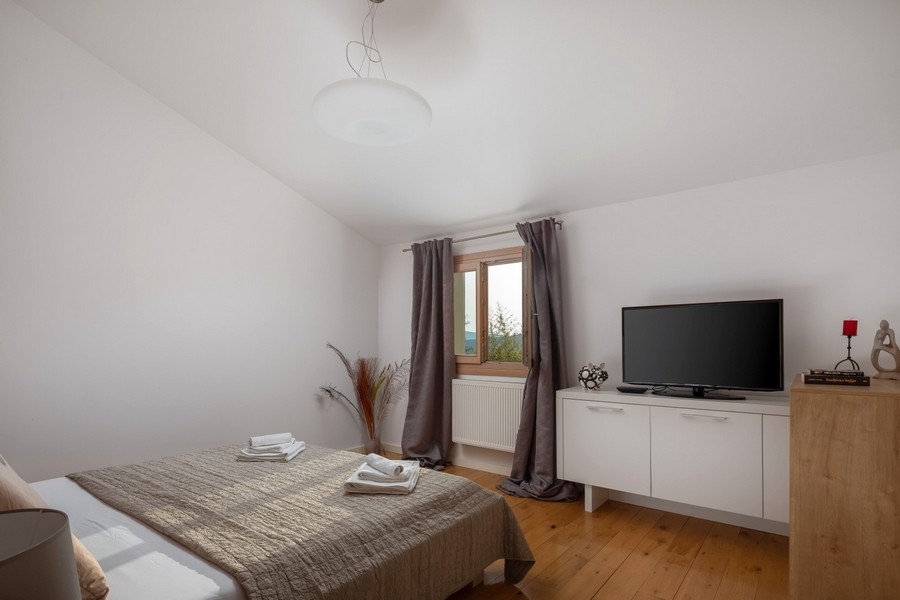 Bedroom with double bed and television
