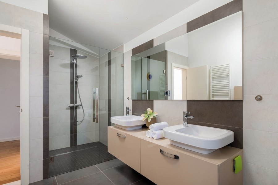 Modern bathroom with shower and double sink