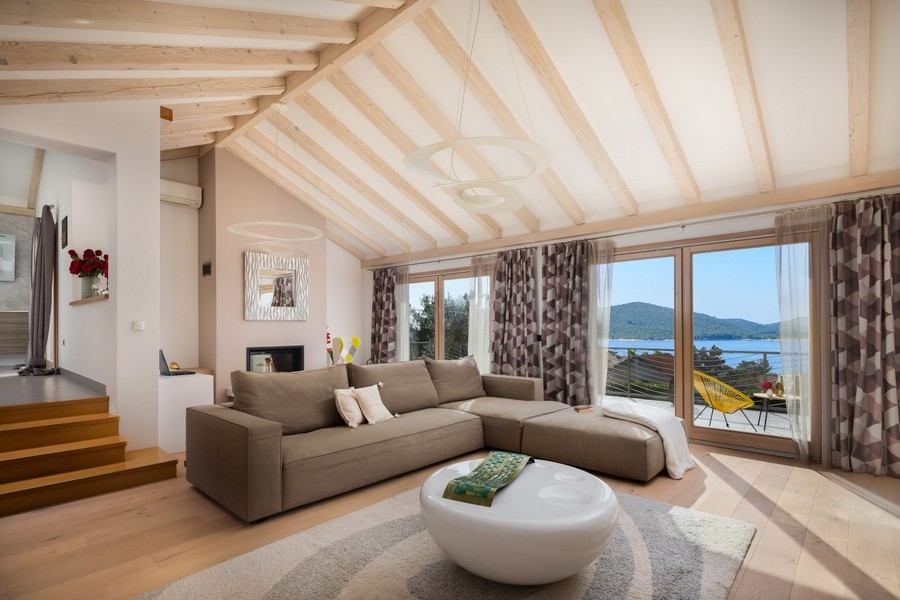 Spacious living room with sofas and sea views