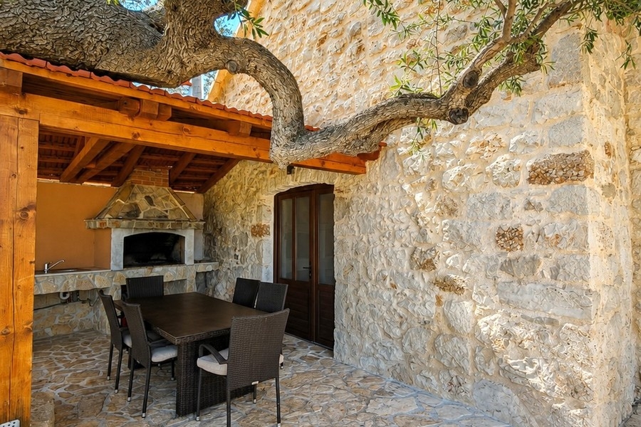 Covered seating area with stone grill